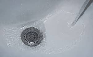 water coming up shower drain