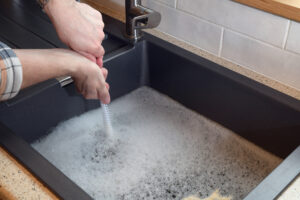 sink with clogged drain full of water